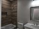 Bathroom showcasing a shower-over-tub setup, sleek vanity, and stylish modern finishes at 26308 W Camino Del Sol --, Casa Grande, AZ 85193