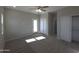 Light bedroom with carpet, sliding closet doors, a ceiling fan and neutral walls at 26308 W Camino Del Sol --, Casa Grande, AZ 85193