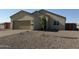 Charming single-story home featuring a two-car garage and low maintenance desert landscaping at 26308 W Camino Del Sol --, Casa Grande, AZ 85193