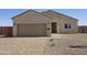 Charming single-story home featuring a two-car garage, block wall, and desert landscaping at 26308 W Camino Del Sol --, Casa Grande, AZ 85193