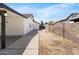 Backyard view featuring a large lot, a concrete patio, and a block fence at 2640 E Mallory St, Mesa, AZ 85213