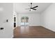 Spacious bedroom with wood-look floors, a ceiling fan, and access to the backyard pool at 2640 E Mallory St, Mesa, AZ 85213