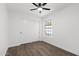 Clean bedroom featuring a ceiling fan, a sliding-door closet, and a window for natural light at 2640 E Mallory St, Mesa, AZ 85213
