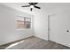 Bedroom featuring laminate flooring, a closet, and a window with neighborhood views at 2640 E Mallory St, Mesa, AZ 85213