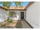 Close-up showcasing the entryway with the front door and a well-kept landscape at 2640 E Mallory St, Mesa, AZ 85213