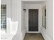 An inviting entry with an elegant, multi-paneled front door and sleek hardware at 2640 E Mallory St, Mesa, AZ 85213