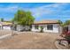 Lovely home with a tile roof and landscaping features, showcasing curb appeal at 2640 E Mallory St, Mesa, AZ 85213