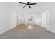 Inviting living area with an open layout, fireplace, and a mix of flooring styles at 2640 E Mallory St, Mesa, AZ 85213