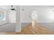 Bright and airy living room with neutral carpet, tile, ceiling fan and arched doorway at 2640 E Mallory St, Mesa, AZ 85213