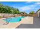 Beautiful backyard featuring a refreshing pool, mature trees and privacy fencing at 2640 E Mallory St, Mesa, AZ 85213