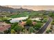 Expansive aerial view of estate with golf course, serene lake, and lush landscaping at 27050 N 103Rd St, Scottsdale, AZ 85262