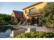 Backyard features a pool, patio, and beautiful landscaping with old world charm at 27050 N 103Rd St, Scottsdale, AZ 85262
