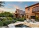 Expansive backyard patio with a tranquil pool, lounge chairs, and lush desert landscaping, perfect for outdoor living at 27050 N 103Rd St, Scottsdale, AZ 85262