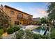 Spacious backyard with a sparkling pool, lounging area, and meticulous landscaping, ideal for relaxation and entertaining at 27050 N 103Rd St, Scottsdale, AZ 85262