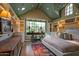 Bright bedroom with built-in shelves, a large window with a view, and hardwood floors with an area rug at 27050 N 103Rd St, Scottsdale, AZ 85262