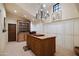 Walk-in closet with custom cabinetry and a center island, offering ample storage and organization at 27050 N 103Rd St, Scottsdale, AZ 85262