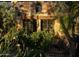 Stone facade with arch window and garden details provides old world charm at 27050 N 103Rd St, Scottsdale, AZ 85262