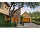 Beautiful home featuring stone accents, a circular window, and a charming garage at 27050 N 103Rd St, Scottsdale, AZ 85262