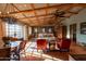 Spacious living room with exposed wood beams, comfortable seating, and an abundance of natural light at 27050 N 103Rd St, Scottsdale, AZ 85262