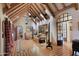 Elegant main bedroom featuring exposed beams, archways, and lots of natural light for a cozy atmosphere at 27050 N 103Rd St, Scottsdale, AZ 85262