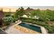 Pool with lounge seating, a mountain view, and lush landscaping at 27050 N 103Rd St, Scottsdale, AZ 85262