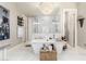Stunning bathroom highlighting a soaking tub, frameless shower, elegant lighting and modern fixtures at 30857 N 128Th Dr, Peoria, AZ 85383