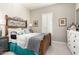 Comfortable bedroom with wood furnishings, plush pillows, and plenty of natural light at 30857 N 128Th Dr, Peoria, AZ 85383