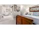 Bedroom featuring wood bed frame, wall art, and easy access to other rooms at 30857 N 128Th Dr, Peoria, AZ 85383