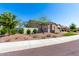 Attractive two-story home with desert landscaping, manicured bushes, and a cozy, inviting feel at 30857 N 128Th Dr, Peoria, AZ 85383