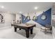 Recreational room with a pool table, stylish light fixture, and decorative mirrors enhancing the entertainment space at 30857 N 128Th Dr, Peoria, AZ 85383