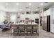 Open kitchen features a spacious island with seating and stainless steel appliances at 30857 N 128Th Dr, Peoria, AZ 85383