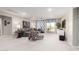 Spacious living room offering comfortable seating, access to balcony and ample space for entertainment at 30857 N 128Th Dr, Peoria, AZ 85383