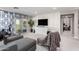Bright living room with modern decor, balcony access, and exercise equipment for a healthy lifestyle at 30857 N 128Th Dr, Peoria, AZ 85383