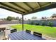 Spacious backyard with a well-maintained lawn and patio area, perfect for outdoor gatherings at 325 W San Angelo St, Gilbert, AZ 85233