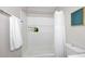 Clean bathroom with a shower-tub combo, tile surround, and recessed storage niche at 325 W San Angelo St, Gilbert, AZ 85233