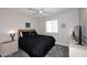 Comfortable bedroom featuring a ceiling fan, window with blinds, and neutral decor at 325 W San Angelo St, Gilbert, AZ 85233