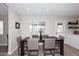 Elegant dining area featuring a dark wood table, modern chairs, and stylish lighting at 325 W San Angelo St, Gilbert, AZ 85233
