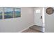 Bright entryway with neutral walls, tile flooring, and a classic white door with a window insert at 325 W San Angelo St, Gilbert, AZ 85233