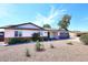 Charming single-story home with well-kept landscaping, a neutral-colored exterior, and an attached garage at 325 W San Angelo St, Gilbert, AZ 85233