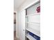Hall closet with sliding doors and empty white shelves for plenty of extra storage space at 325 W San Angelo St, Gilbert, AZ 85233