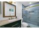 Modern bathroom with stylish blue tile in shower, elegant vanity, and fixtures at 332 E Houston Ave, Gilbert, AZ 85234