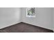 Cozy bedroom with plush carpeting and a bright window at 332 E Houston Ave, Gilbert, AZ 85234