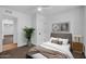Bedroom with neutral colors, carpeted floors, and minimalist decor with framed art at 332 E Houston Ave, Gilbert, AZ 85234