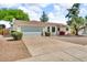 Attractive single-story house showcasing a two-car garage and low maintenance landscaping at 332 E Houston Ave, Gilbert, AZ 85234