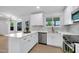 Bright kitchen with white cabinetry, stainless steel appliances, ample counter space, and modern fixtures at 332 E Houston Ave, Gilbert, AZ 85234