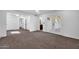 Expansive living area featuring plush carpeting and multiple entrances to other rooms at 332 E Houston Ave, Gilbert, AZ 85234