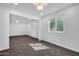 Bright living room with neutral walls, plush carpeting, and natural light at 332 E Houston Ave, Gilbert, AZ 85234