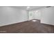 Bright living room with neutral walls and plush carpeting with views to another room at 332 E Houston Ave, Gilbert, AZ 85234