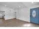 Bright living room featuring recessed lighting, new flooring and a blue front door at 332 E Houston Ave, Gilbert, AZ 85234