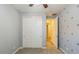 This bedroom features carpet, a closet with slider doors, and gray airplane-themed wallpaper at 3386 E Strawberry Dr, Gilbert, AZ 85298